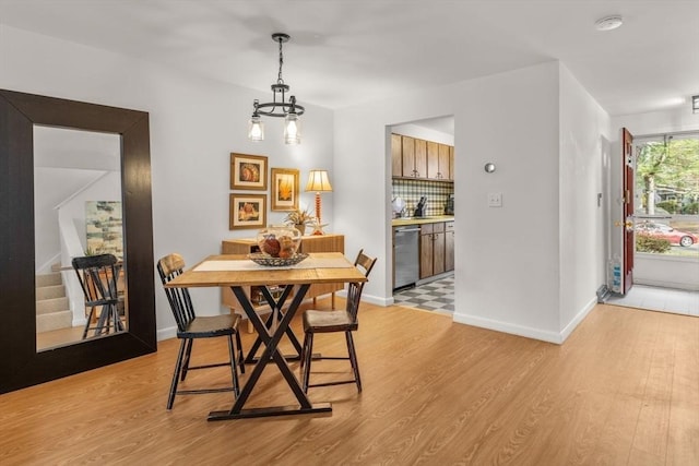 dining space with light hardwood / wood-style floors