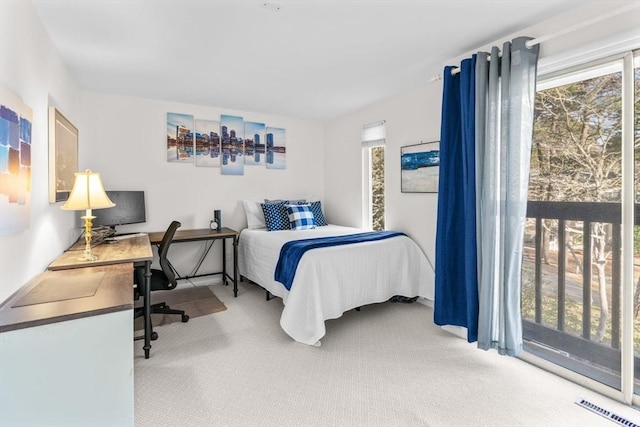 bedroom featuring carpet flooring and access to exterior