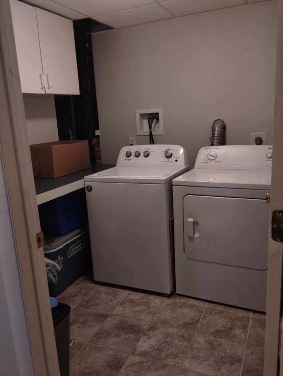 laundry area featuring cabinets and washing machine and dryer