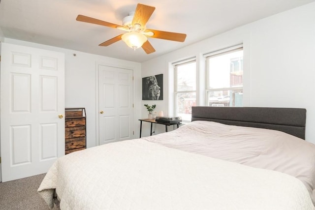 carpeted bedroom with ceiling fan