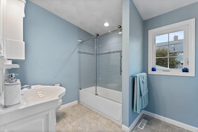 bathroom featuring combined bath / shower with glass door and tile patterned floors