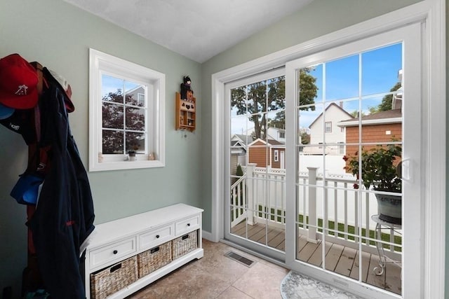 entryway with light tile patterned floors