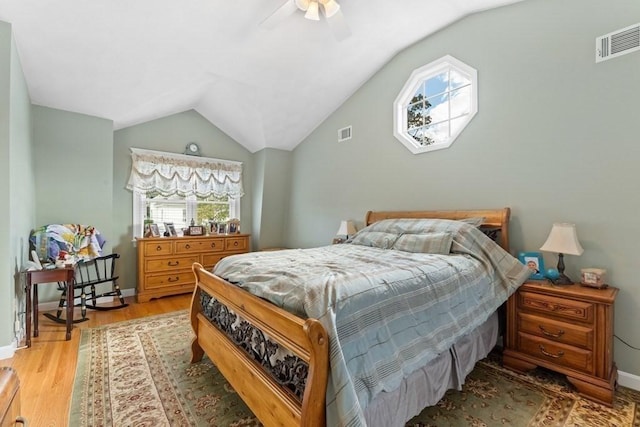 bedroom featuring ceiling fan, vaulted ceiling, and hardwood / wood-style floors