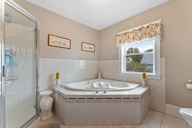 bathroom with toilet, independent shower and bath, and tile patterned flooring