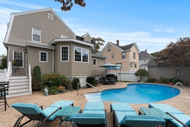 view of pool featuring a patio