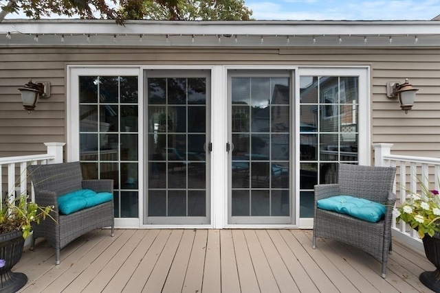 wooden deck featuring french doors