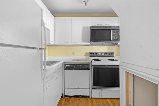 kitchen with light countertops, dark wood-type flooring, white cabinetry, and white appliances