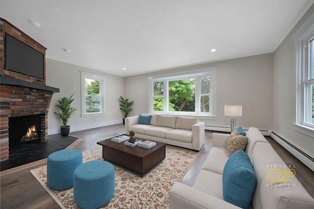 9 Garfield St, Dartmouth, MA 02748 - living area with plenty of natural light, wood finished floors, baseboard heating, and recessed lighting
