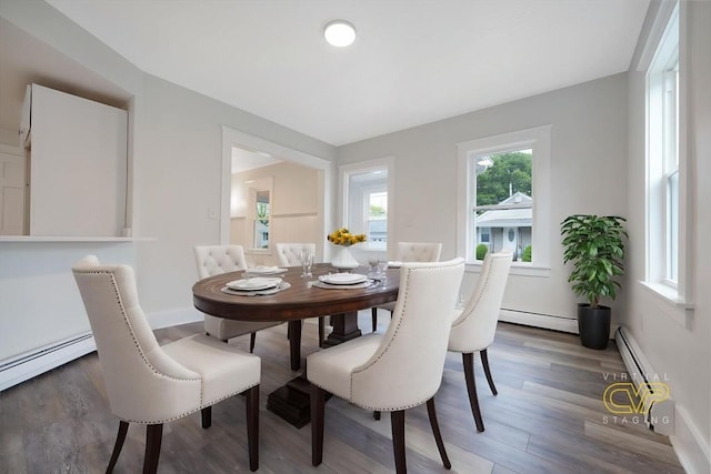 9 Garfield St, Dartmouth, MA 02748 - dining space featuring baseboard heating, wood finished floors, and baseboards