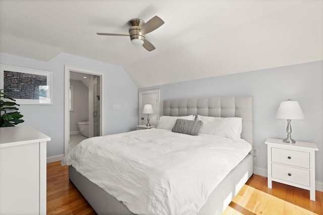 60 Starbird Ave Unit 2, Boston, MA 02131 - bedroom with wood finished floors, vaulted ceiling, baseboards, connected bathroom, and a ceiling fan