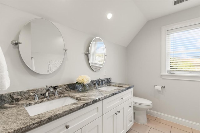60 Starbird Ave Unit 2, Boston, MA 02131 - full bath featuring vaulted ceiling, double vanity, toilet, baseboards, and tile patterned flooring
