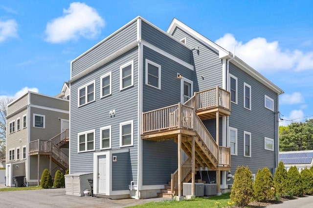 60 Starbird Ave Unit 2, Boston, MA 02131 - back of property featuring stairs, central air condition unit, and a deck