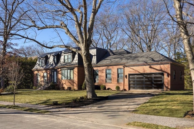 view of front of home with a garage and a front lawn