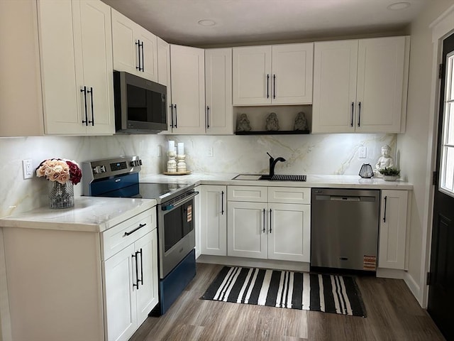 61 Esta Rd, Plymouth, MA 02360 - kitchen featuring stainless steel appliances, dark wood-style flooring, white cabinets, and backsplash