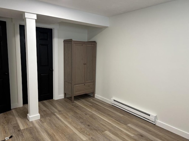61 Esta Rd, Plymouth, MA 02360 - basement featuring a baseboard radiator and wood finished floors