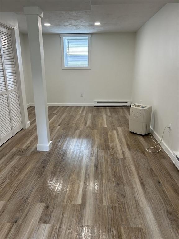 61 Esta Rd, Plymouth, MA 02360 - basement with a baseboard heating unit and wood finished floors
