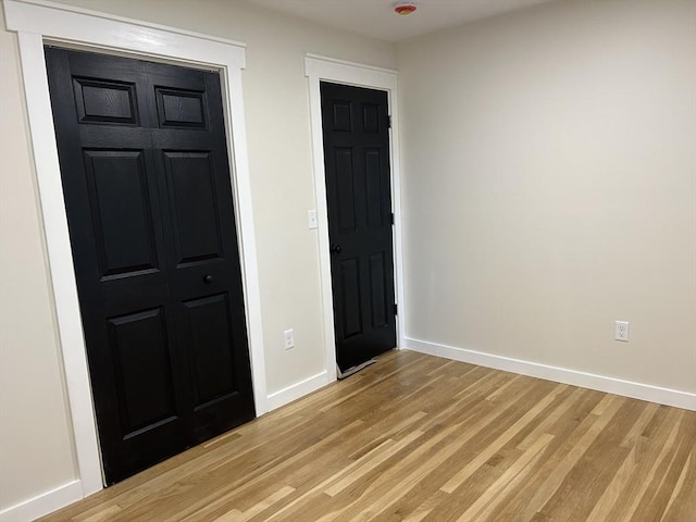 61 Esta Rd, Plymouth, MA 02360 - unfurnished bedroom with light wood-type flooring and a closet
