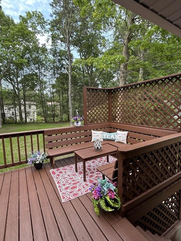 61 Esta Rd, Plymouth, MA 02360 - deck with an outdoor living space and view of scattered trees