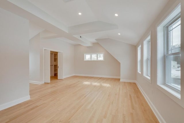 bonus room with recessed lighting, baseboards, vaulted ceiling, and light wood-style floors