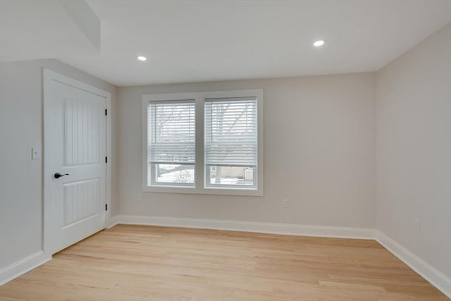 unfurnished room featuring light wood-type flooring, recessed lighting, and baseboards