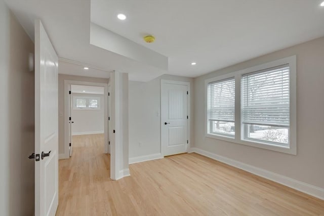 unfurnished bedroom with recessed lighting, baseboards, and light wood-style flooring