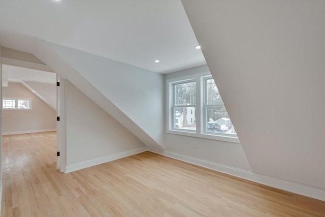 bonus room featuring recessed lighting, baseboards, lofted ceiling, and light wood finished floors