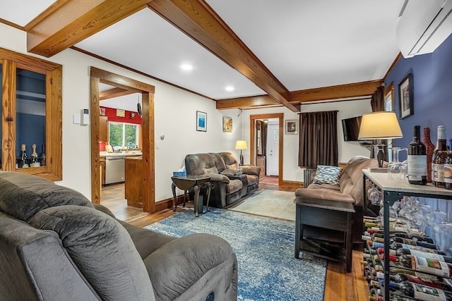 living room featuring beam ceiling, a wall unit AC, and hardwood / wood-style flooring