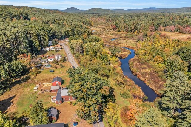 aerial view featuring a water and mountain view