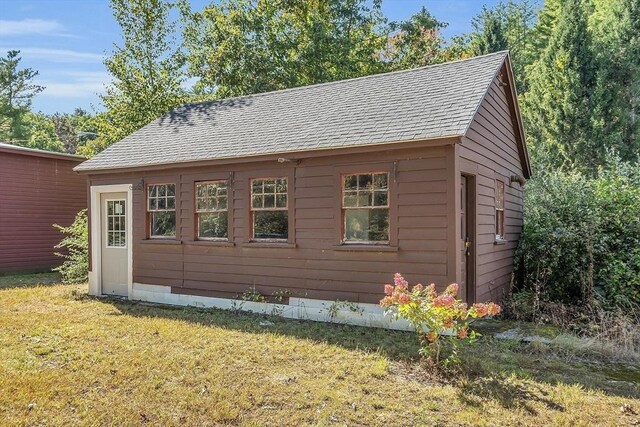 view of home's exterior featuring a yard