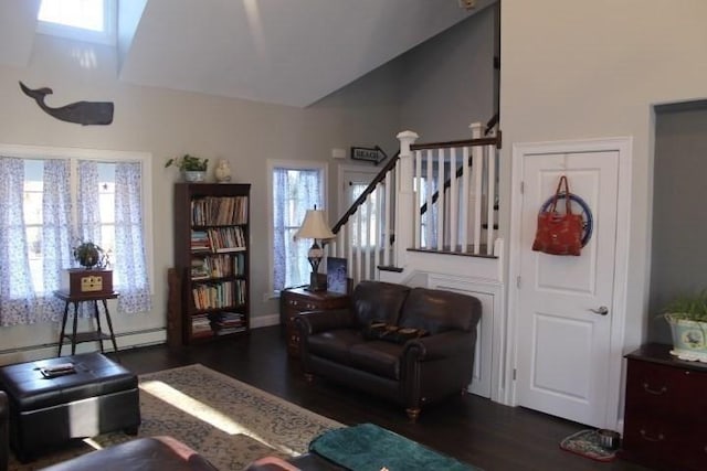 living room with dark hardwood / wood-style flooring, vaulted ceiling, and a baseboard radiator