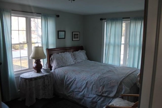 bedroom with multiple windows