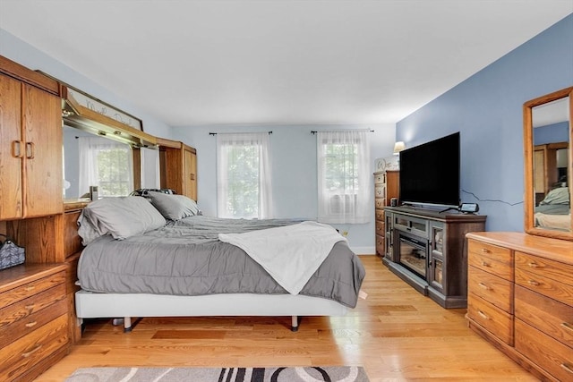 bedroom with light hardwood / wood-style flooring