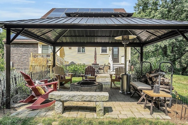 view of patio featuring a gazebo and an outdoor fire pit