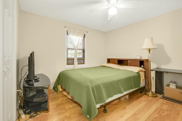 bedroom with wood finished floors and a ceiling fan