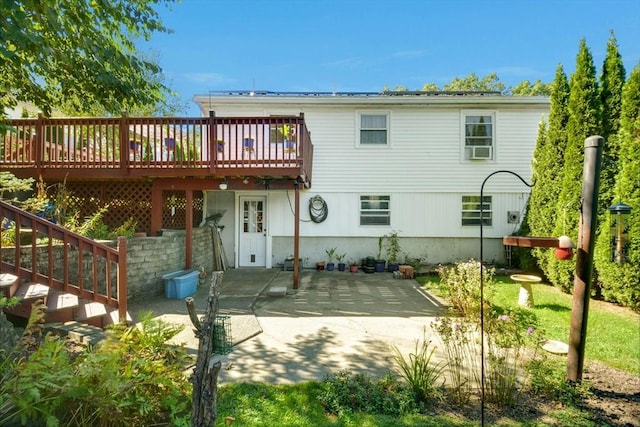 back of house with a patio area and a wooden deck