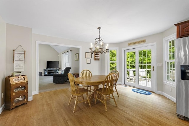 53 Arnold Way, Uxbridge, MA 01569 - dining area featuring light wood finished floors and a chandelier