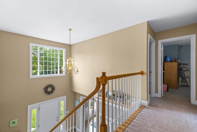 53 Arnold Way, Uxbridge, MA 01569 - corridor featuring a chandelier, an upstairs landing, and carpet
