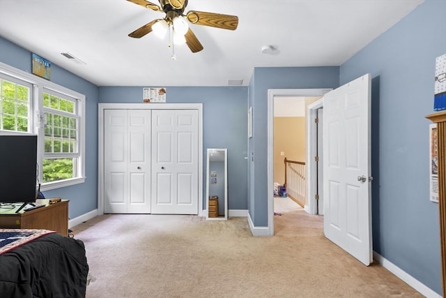 53 Arnold Way, Uxbridge, MA 01569 - bedroom with light carpet, a closet, and a ceiling fan