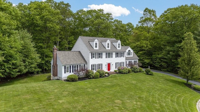 53 Arnold Way, Uxbridge, MA 01569 - view of front of house featuring a front lawn, a chimney, and driveway