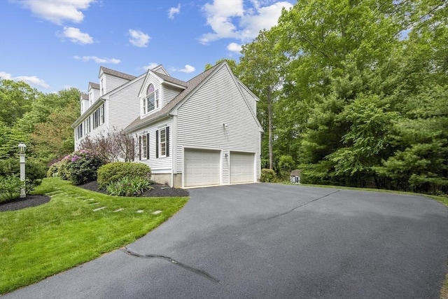 53 Arnold Way, Uxbridge, MA 01569 - view of home's exterior featuring a garage, driveway, and a lawn