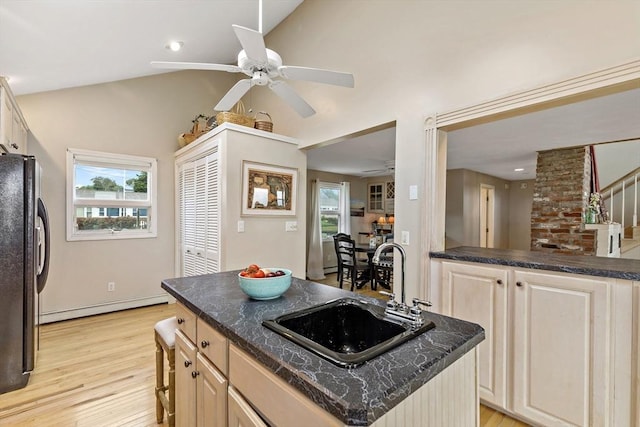 125 Seaview Dr, Plymouth, MA 02360 - kitchen featuring a ceiling fan, a sink, a baseboard heating unit, freestanding refrigerator, and a healthy amount of sunlight