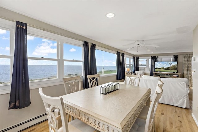 125 Seaview Dr, Plymouth, MA 02360 - dining room featuring a water view, baseboard heating, recessed lighting, light wood-style flooring, and a ceiling fan