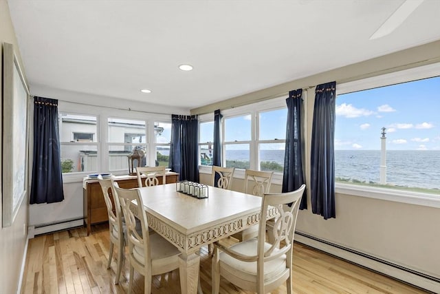 125 Seaview Dr, Plymouth, MA 02360 - dining space with plenty of natural light, light wood-style floors, and baseboard heating