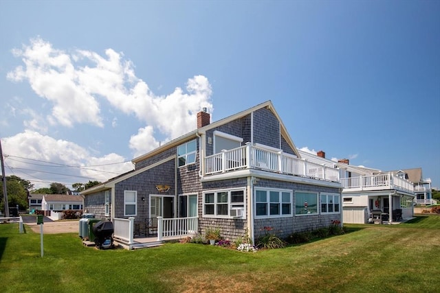 125 Seaview Dr, Plymouth, MA 02360 - rear view of property with a balcony, a yard, cooling unit, and a chimney