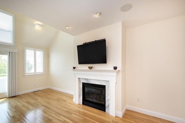 6 State Park Rd Unit 2, Hull, MA 02045 - unfurnished living room featuring wood finished floors, a fireplace, and baseboards