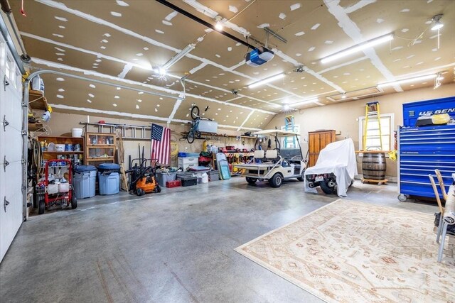 447 Coy Hill Rd, Warren, MA 01083 - garage with a workshop area and a garage door opener
