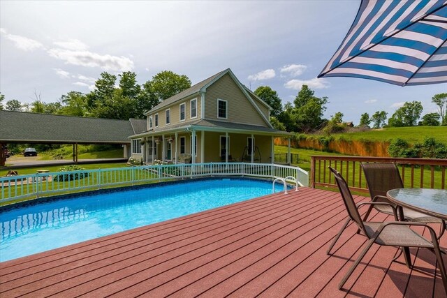 447 Coy Hill Rd, Warren, MA 01083 - view of swimming pool featuring a deck and a lawn