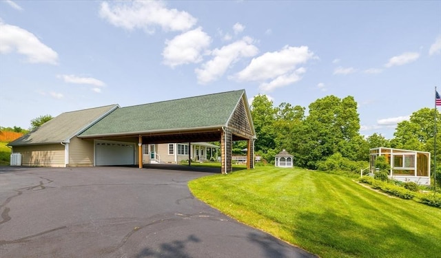 447 Coy Hill Rd, Warren, MA 01083 - view of front facade featuring a carport, a front lawn, and a garage