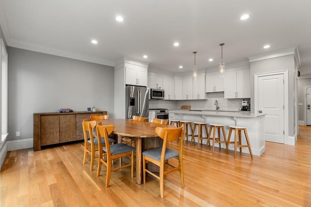 2 Rockwood Ter Unit 2, Newton, MA 02466 - dining space with recessed lighting, crown molding, light wood-style floors, and baseboards