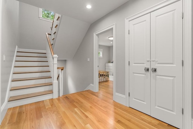 2 Rockwood Ter Unit 2, Newton, MA 02466 - stairway featuring wood finished floors, baseboards, healthy amount of natural light, and recessed lighting